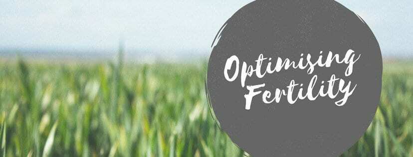 Optimising fertility text overlay on a blurred green field background, emphasizing holistic approaches to improving reproductive health.