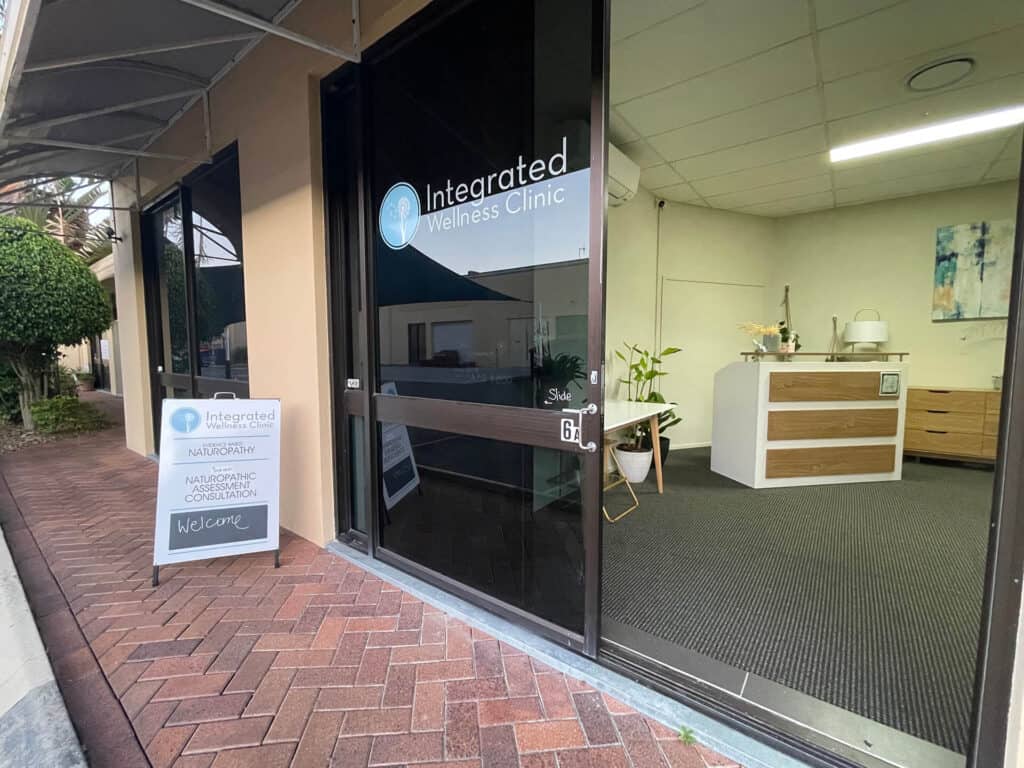 Integrated Wellness Clinic entrance with welcoming sign, showcasing naturopathic services and a modern interior design, located in Queensland.