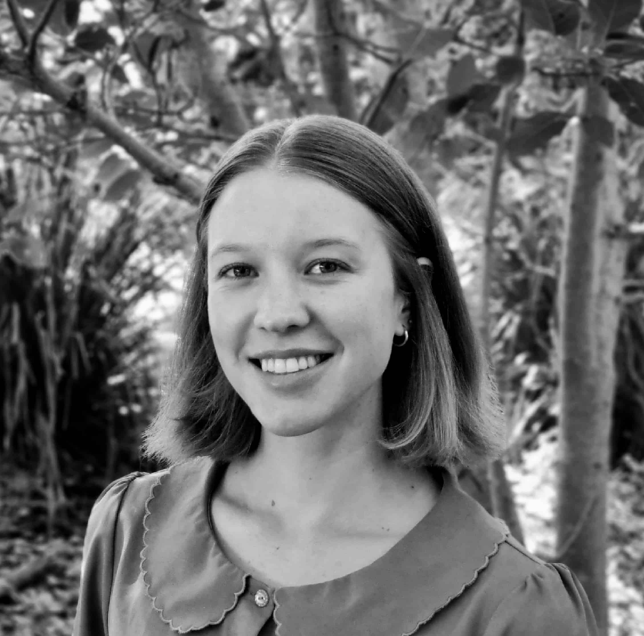 Naturopathic practitioner smiling outdoors, emphasizing holistic health and wellness, relevant to Integrated Wellness Clinic's focus on personalized care for conditions like hormonal imbalance and mental health.