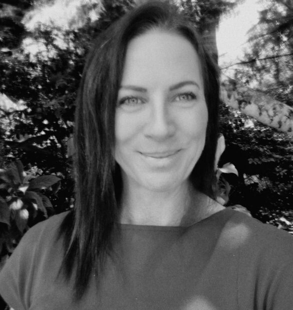 Michelle O’Rourke, registered psychologist, smiling in a natural outdoor setting, promoting a warm and collaborative approach to mental health support.