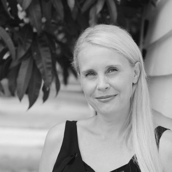 Naturopathic practitioner smiling outdoors, emphasizing holistic health and wellness, aligned with Integrated Wellness Clinic's focus on personalized naturopathy services.