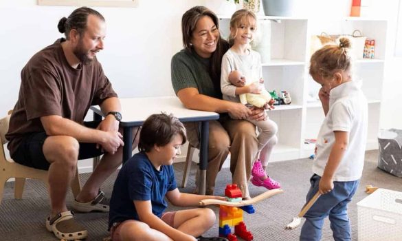Family-friendly environment at Integrated Wellness Clinic, featuring Suzi Le Fanue with children, engaging in play and supportive interactions, reflecting holistic care approach.